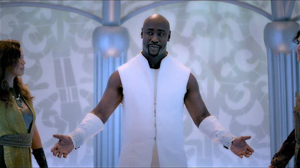Amenadiel standing in a bright celestial setting with open arms, symbolizing redemption, healing, and spiritual transformation.