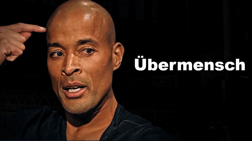 David Goggins pointing to his head beside the word “Übermensch,” symbolizing mental toughness and Nietzschean self-mastery.