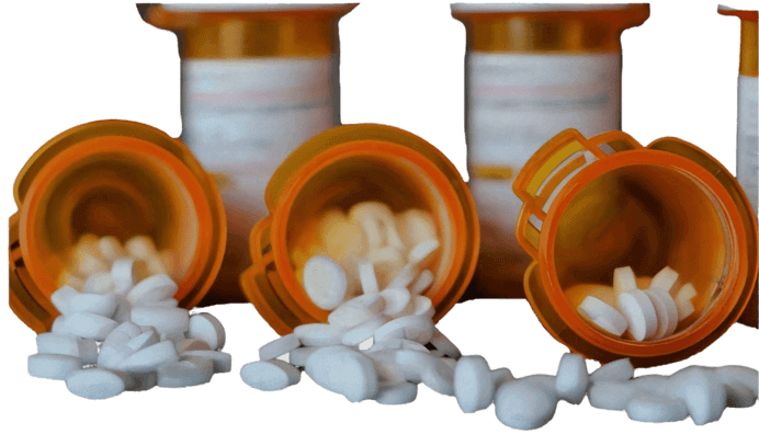 Prescription bottles spill white pills across a surface.