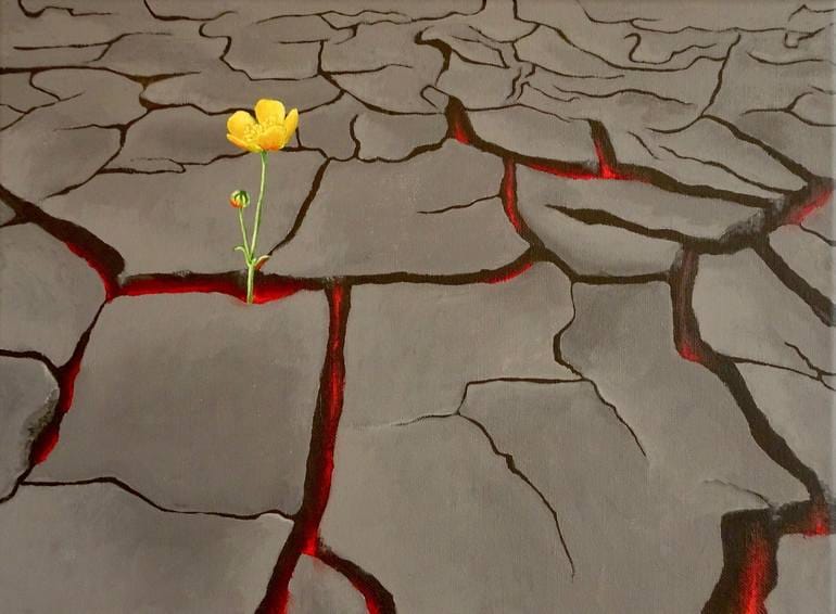 Yellow flower blooming through cracked, scorched ground with red fissures.