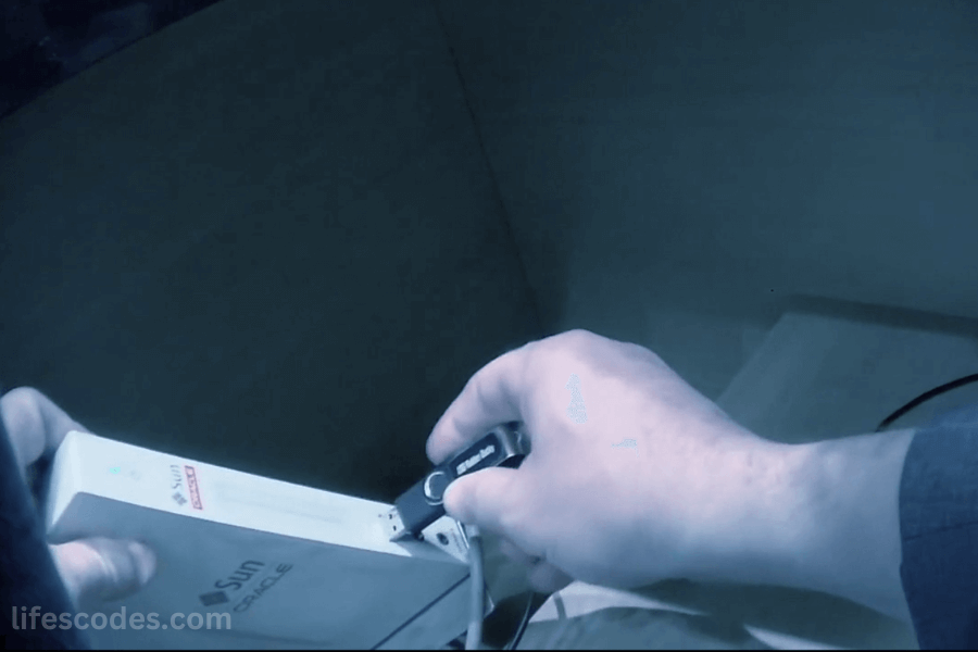 Close-up of a USB stick being plugged into a Sun Oracle computer server