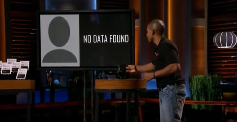 Presenter demonstrating SignalVault RFID protection with a “No Data Found” result on a large screen, countering social engineering threats.